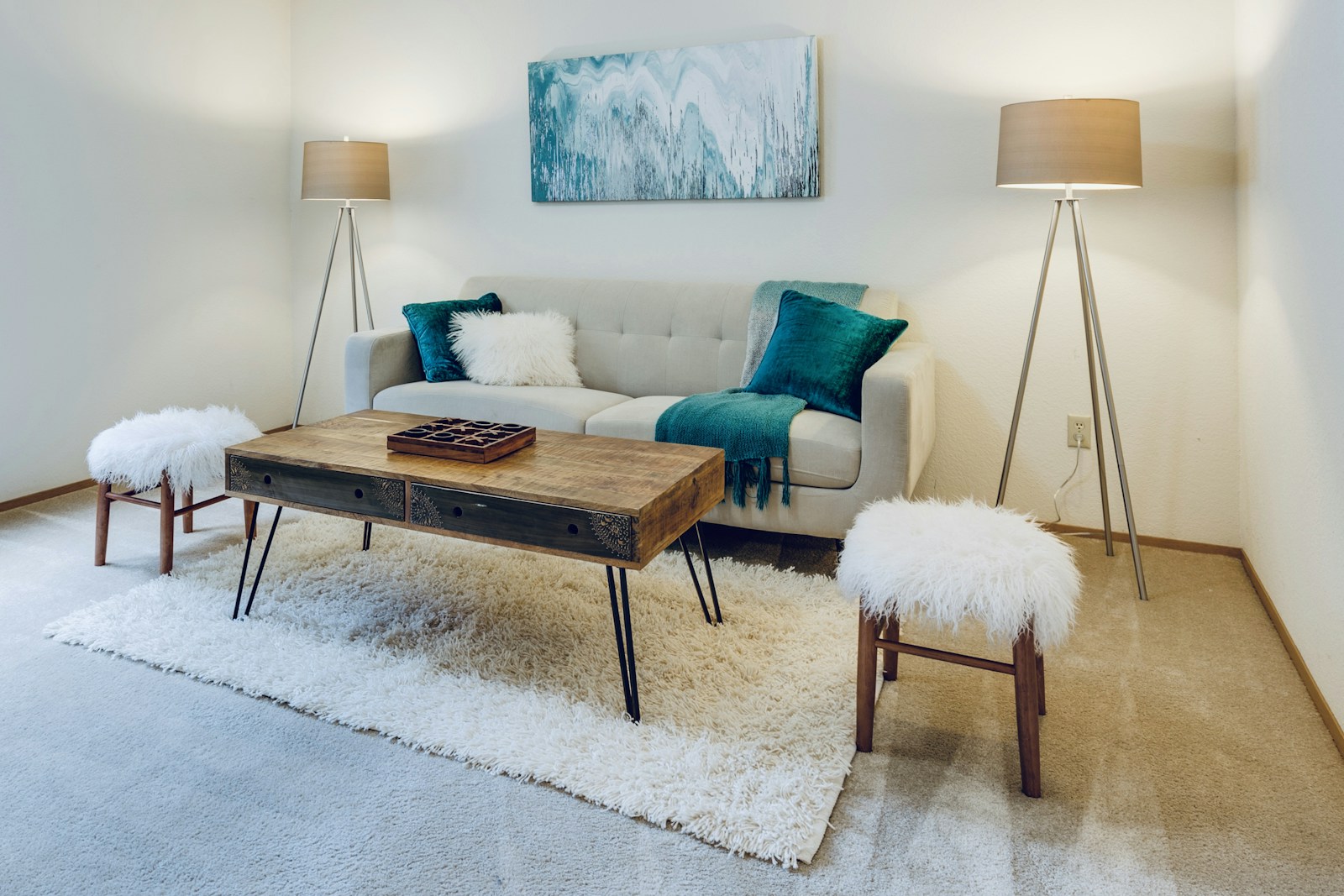 Bright living room with freshly painted neutral walls and blue accents